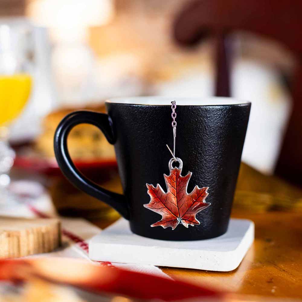 Maple leaf tea infuser in a mug